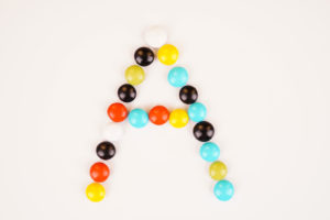 A letter with colorful milk chocolate stock image