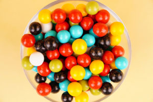 Multicolored round candies close up on background