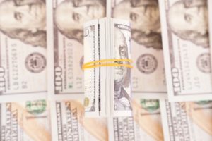 Roll of hundred dollars stock photo